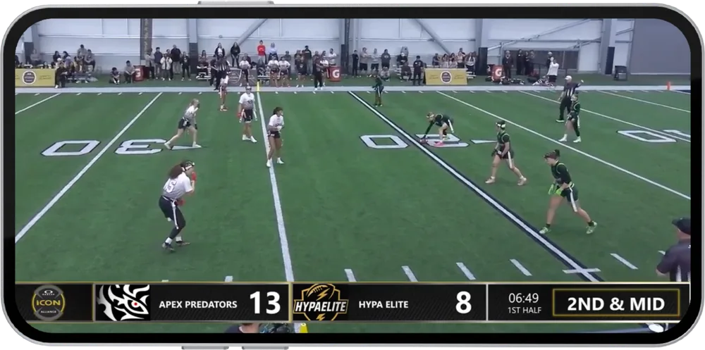 A live stream of a girls flag football game on a phone held sideways, with a broadcast scorebug showing Apex Predators 13, Hypa Elite 8, 6:49 in the first half, 2nd and mid