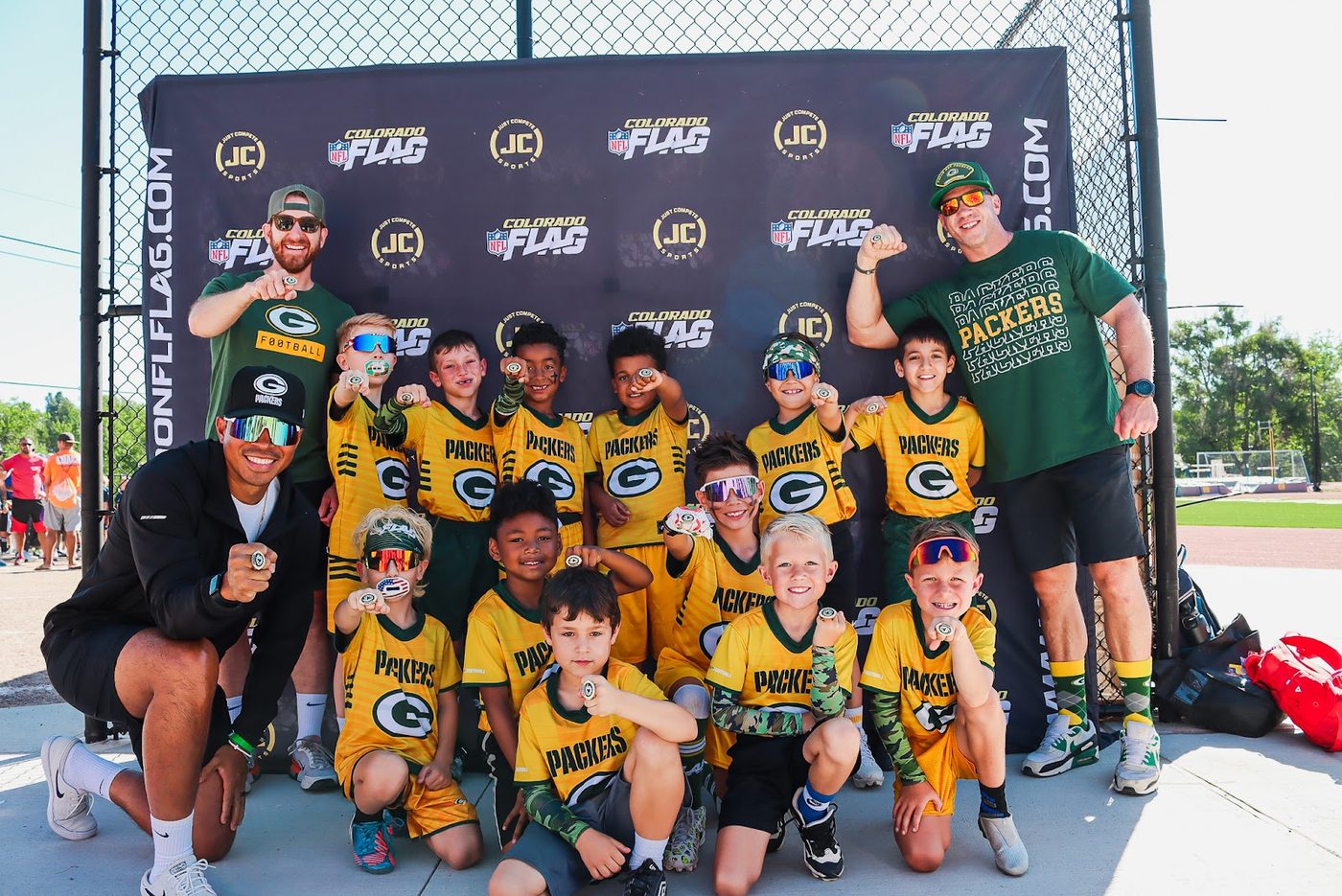 Youth flag football team in gold jerseys