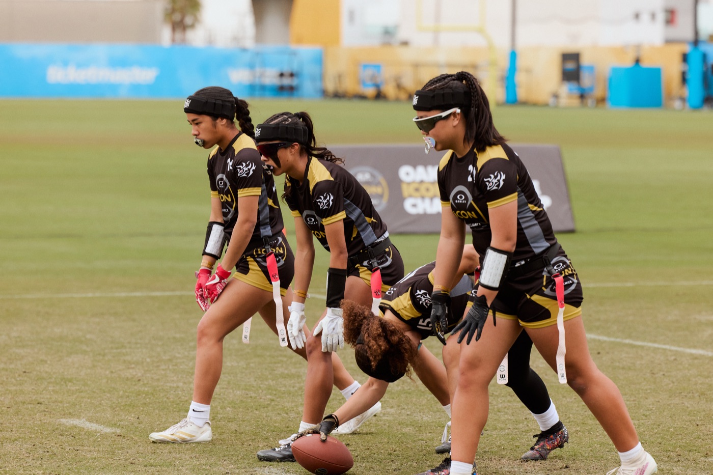 Young athlete pulling a flag on defense